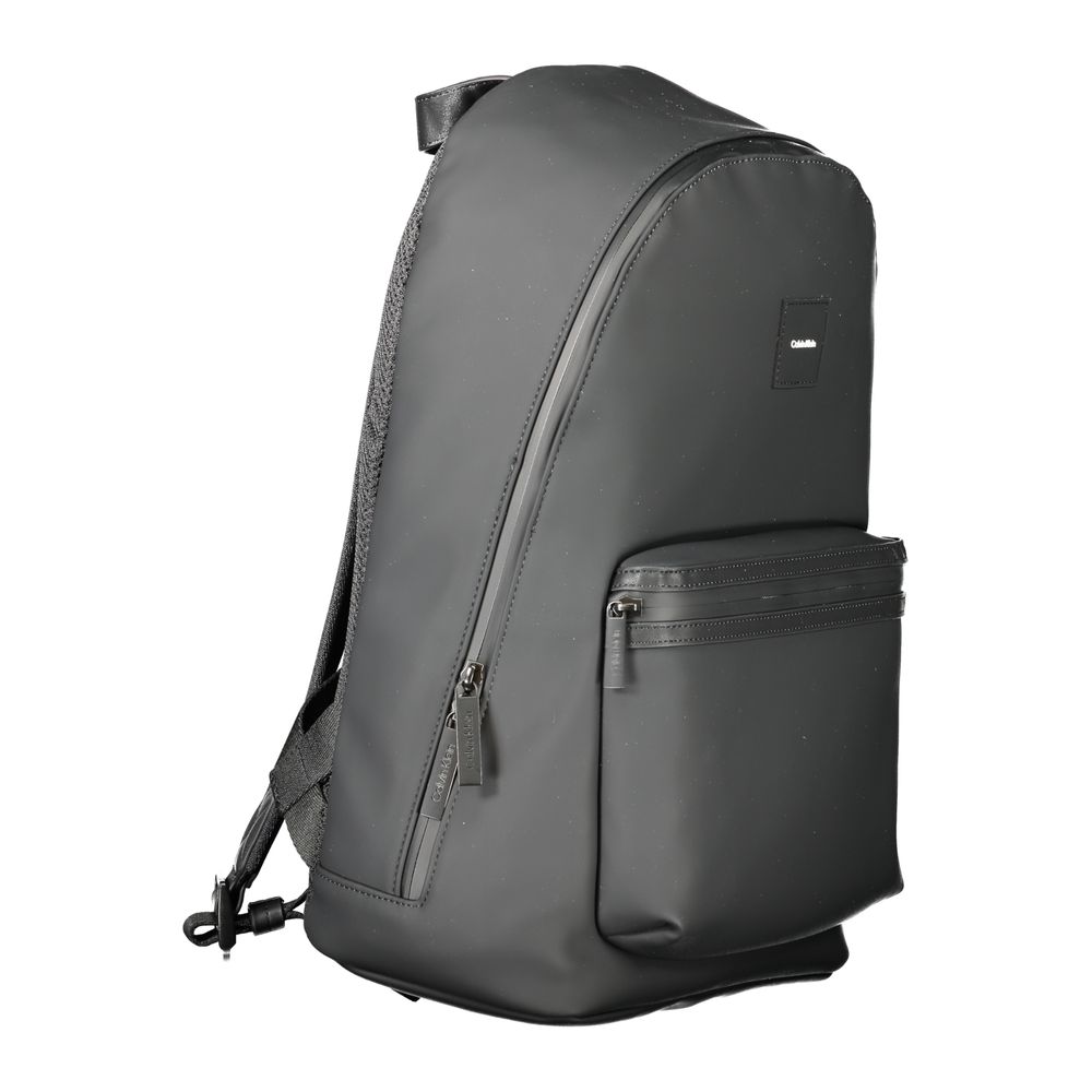 Calvin Klein Black Polyester Men Backpack with adjustable straps and front pocket, offering modern design and ample storage.