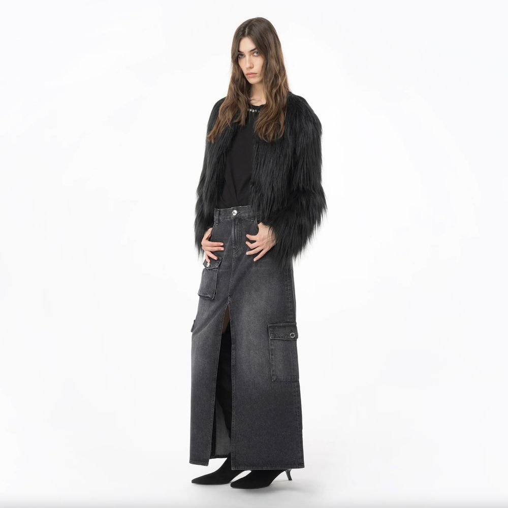 Model wearing PINKO Black Cotton Skirt with long design, zip closure, and multiple pockets. Fashionable and versatile skirt.