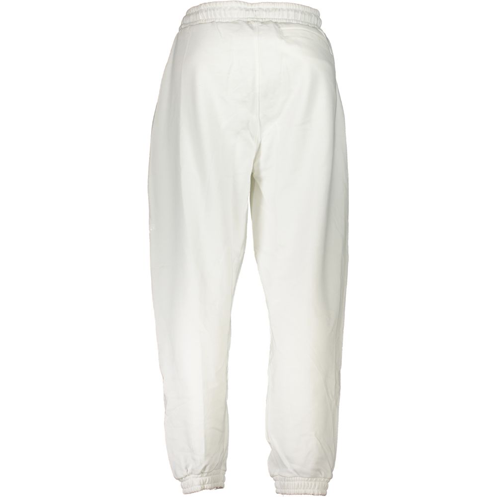 Calvin Klein White Cotton Pant with elastic waist, laces, 3 pockets, brushed fabric, ankle elastic, and logo print. Sports trousers.