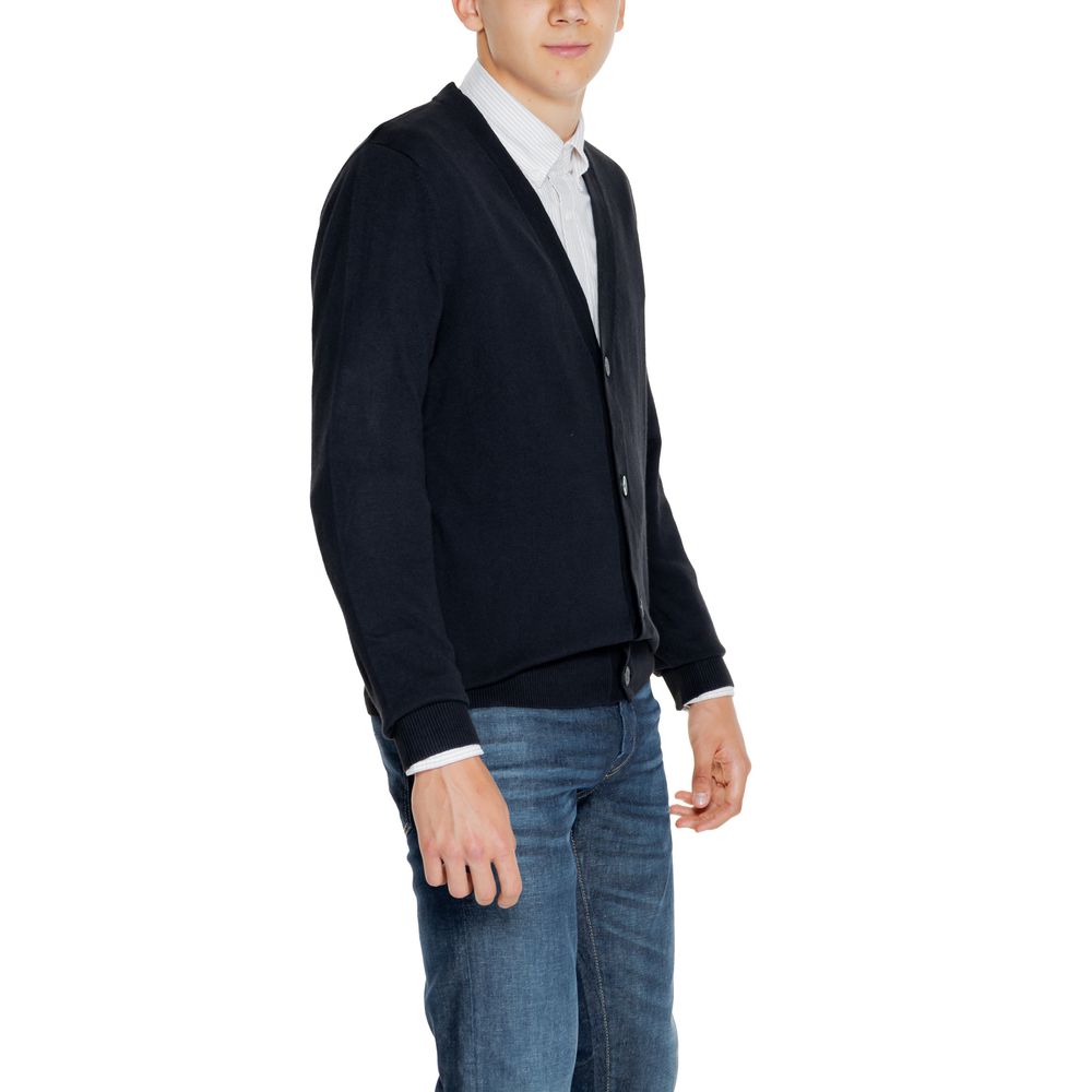 Man wearing Jack Jones Black Cotton Cardigan with V-neckline and button-down front paired with jeans