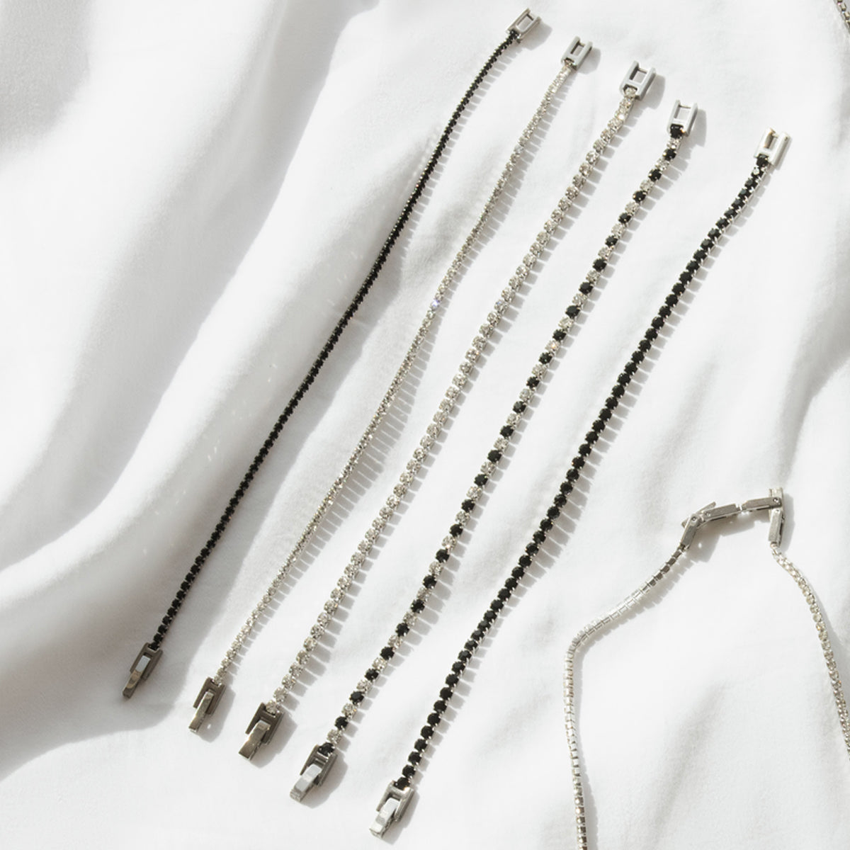 RADIANT JEWELS JEWELRY Mod. RH000011 silver and black bracelets on white background