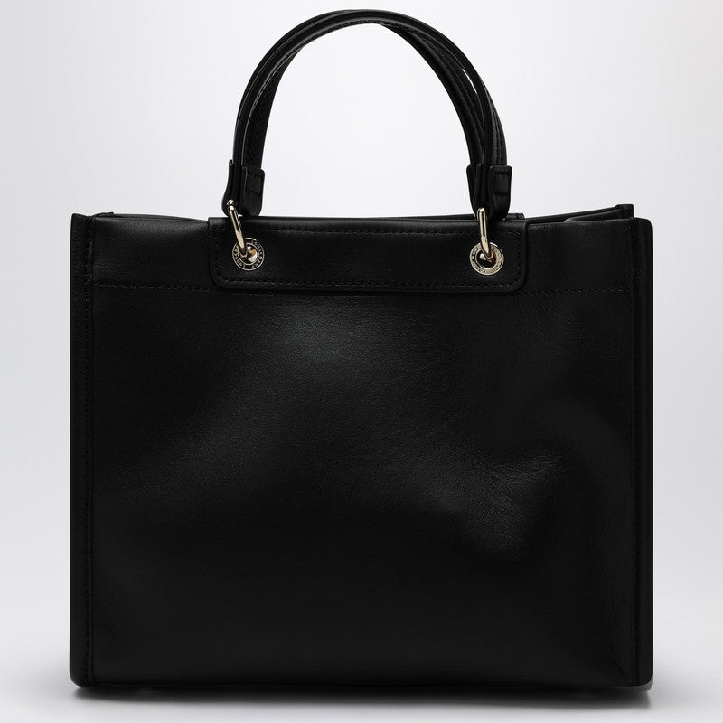 Front view with bag zipped and handles upright.