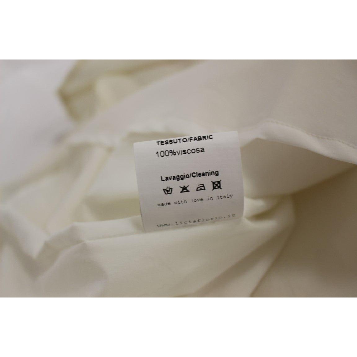 فستان أنيق من Licia Florio باللون الأبيض مع رقبة على شكل حرف V