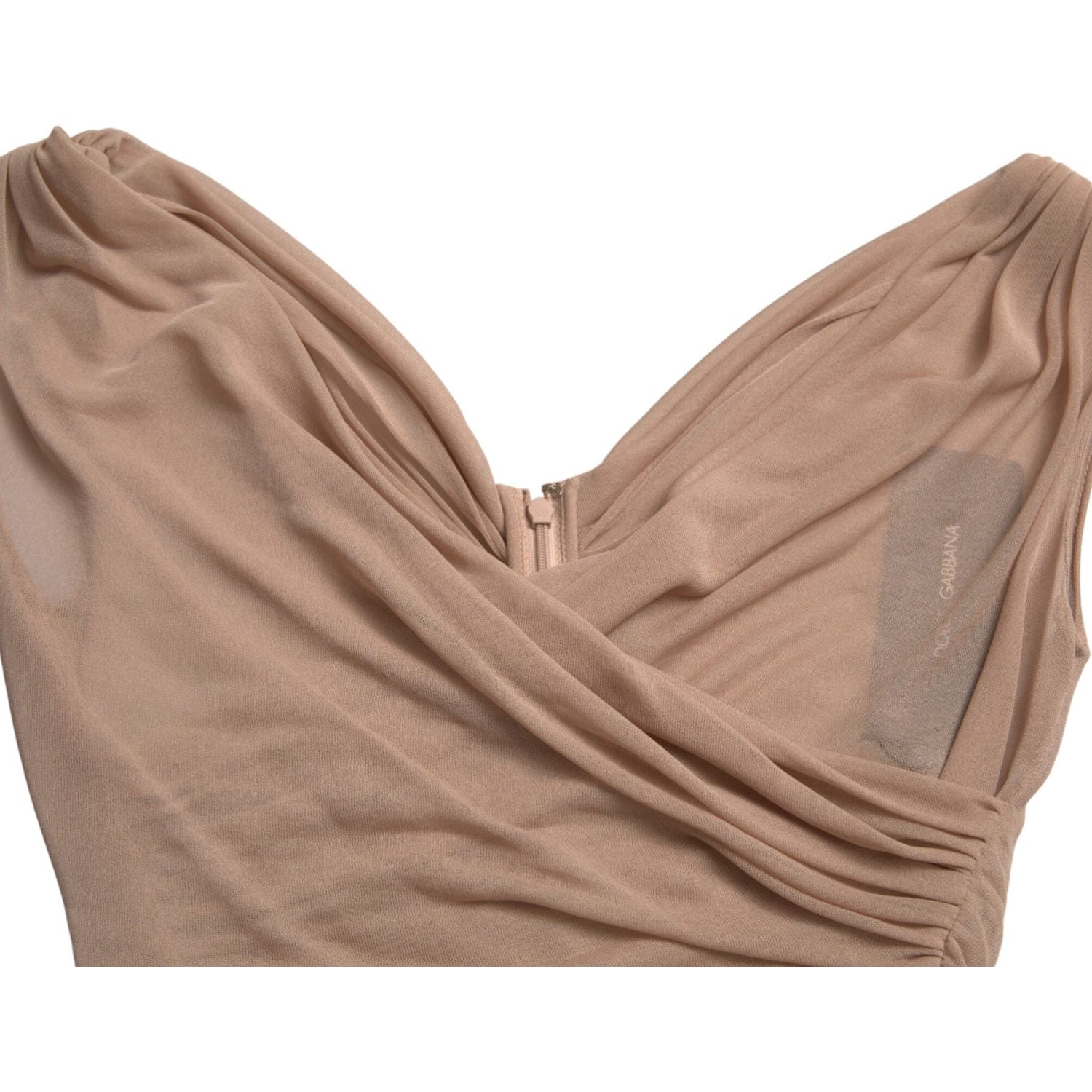 بلوزة دولتشي آند غابانا الأنيقة باللون البيج الشفافة بدون أكمام وفتحة رقبة على شكل حرف V