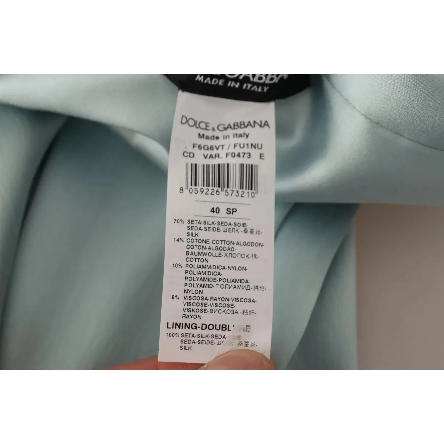 فستان دولتشي آند غابانا حرير أخضر نعناعي بقصّة كتف واحدة متوسط ​​الطول