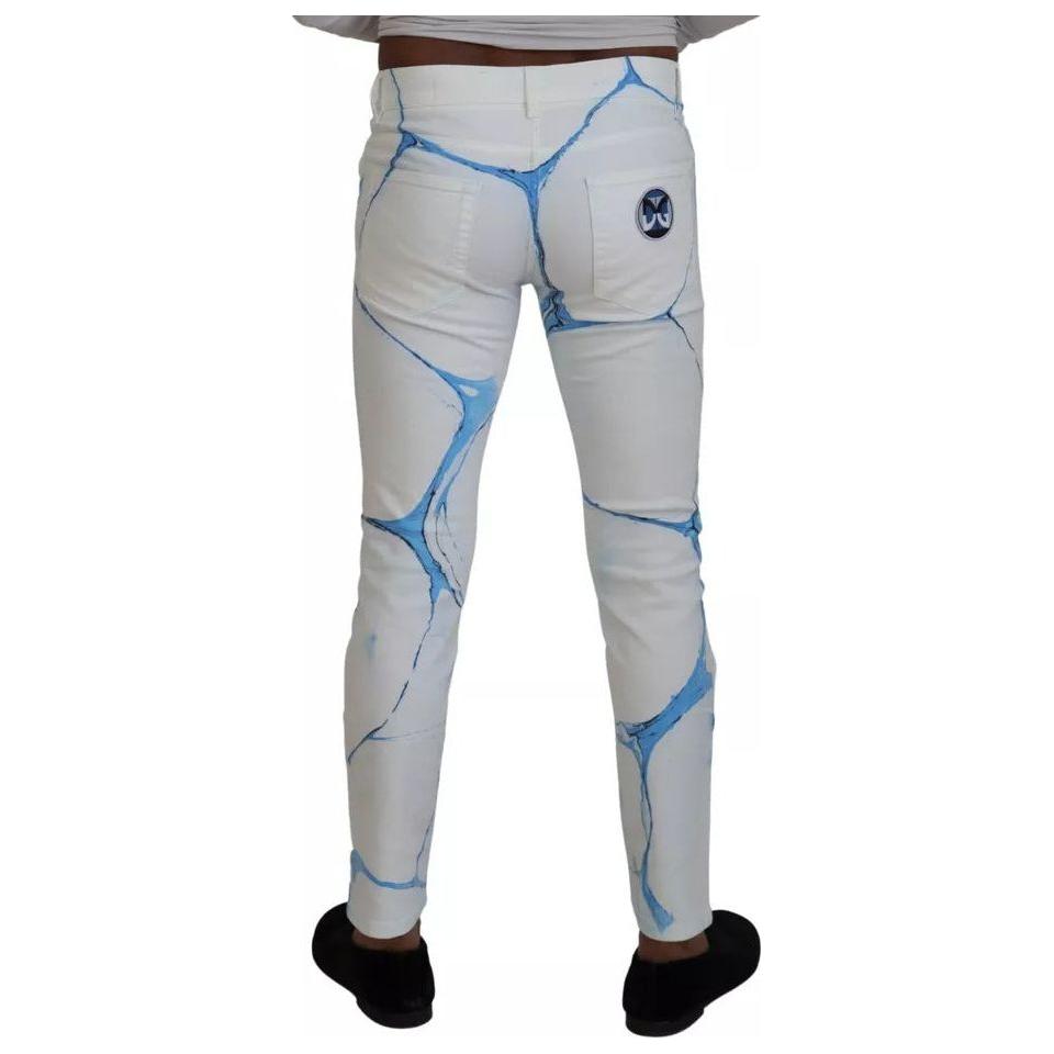 بنطلون جينز ضيق من القطن باللون الأبيض والأزرق من دولتشي آند غابانا