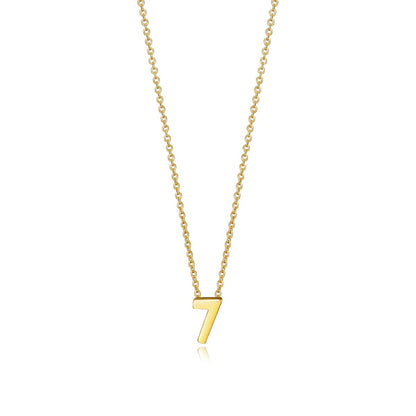 Gold necklace with numeral '7' pendant, elegant design.