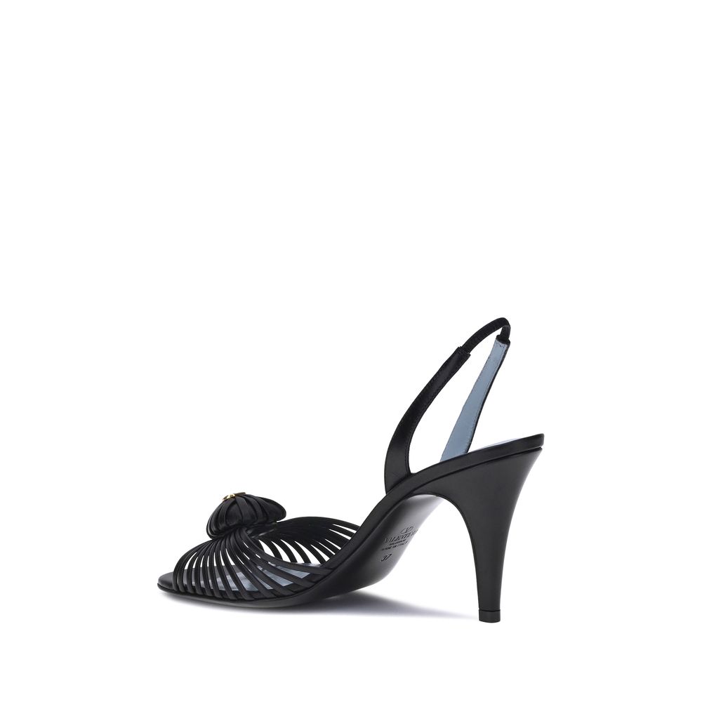Valentino Garavani Royal Sandals in black leather with 3D heart VLogo and slingback style for AW25, made in Italy.