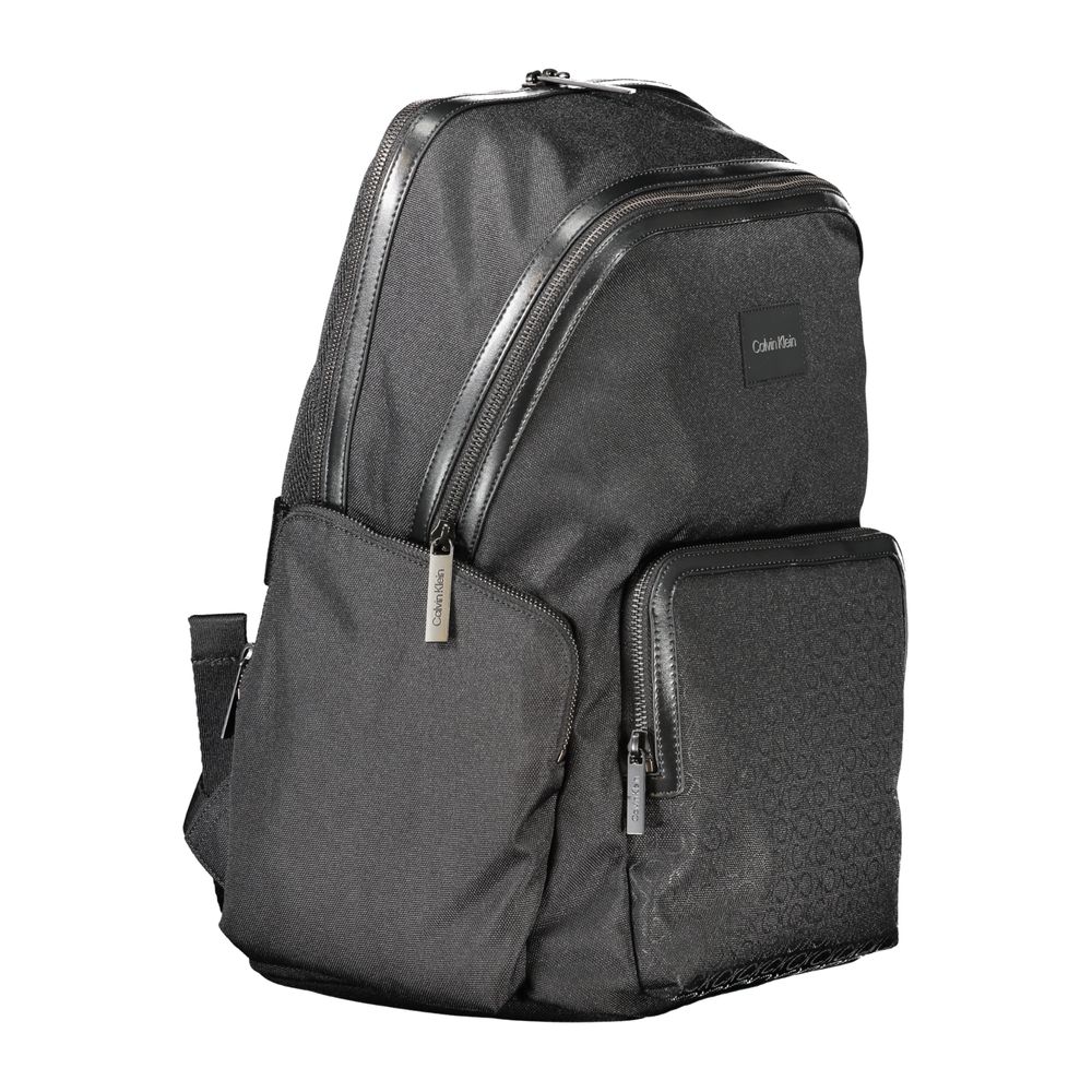 Calvin Klein Black Polyester Backpack with multiple pockets, adjustable straps, laptop compartment, and recycled materials.