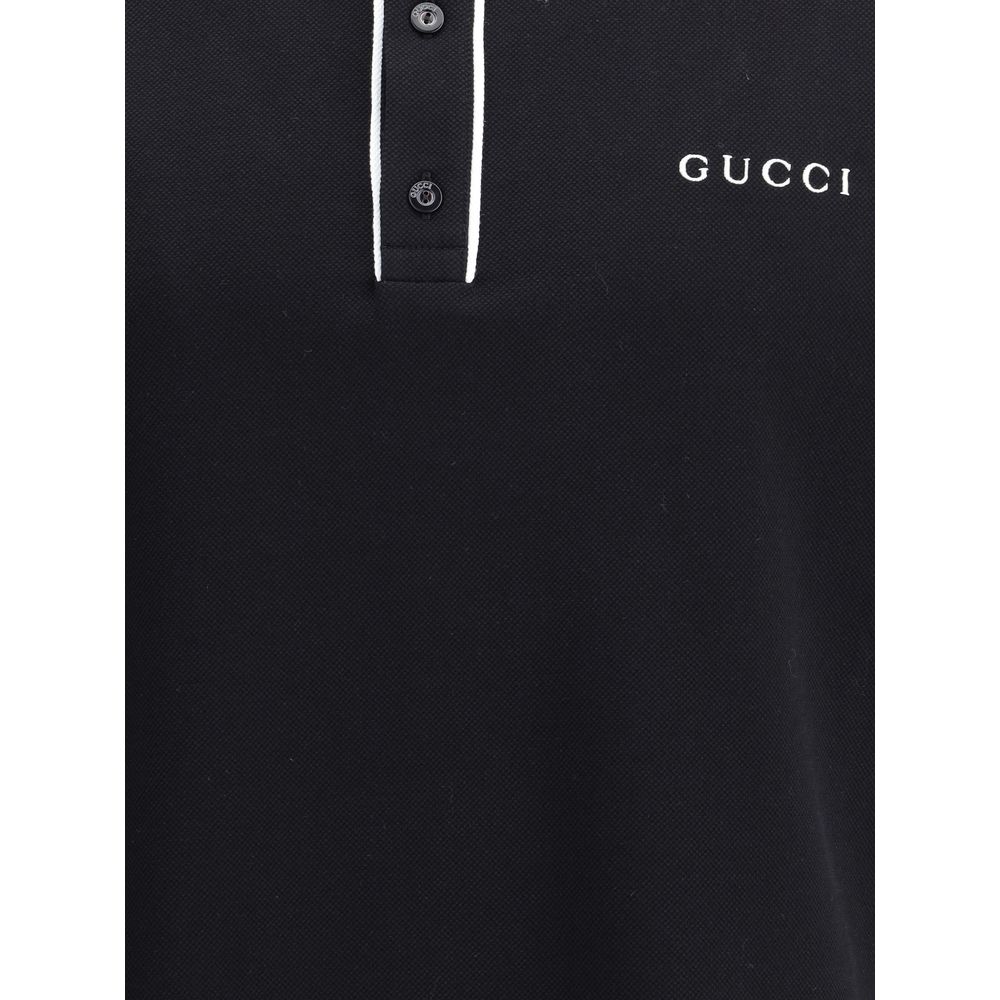 Gucci Black Cotton Polo Shirt with classic collar, contrasting buttons, and iconic monogram, offering sporty elegance for AW25.