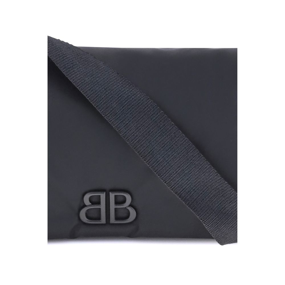 Balenciaga Black Polyamide Shoulder Bag with logo plaque and adjustable strap, showcasing minimalist design and modern elegance.