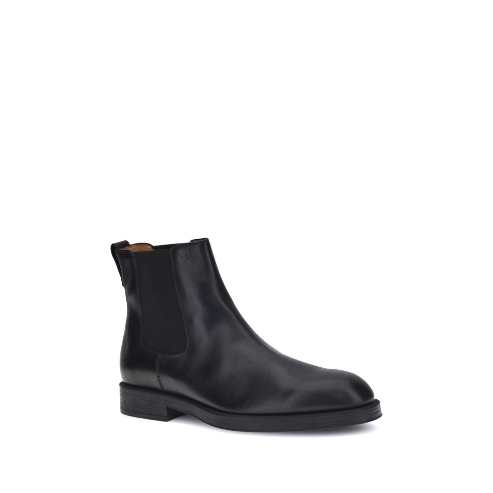 Tod's Black Calf Leather Bos Taurus Chelsea Boots with elastic side inserts and back tab for comfort.