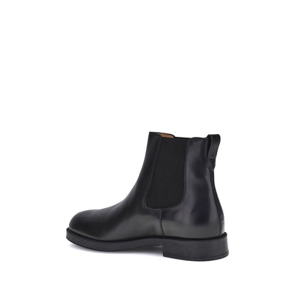 Alt Tag: Side view of Tod's Black Calf Leather Bos Taurus Chelsea Boots with elastic side inserts.