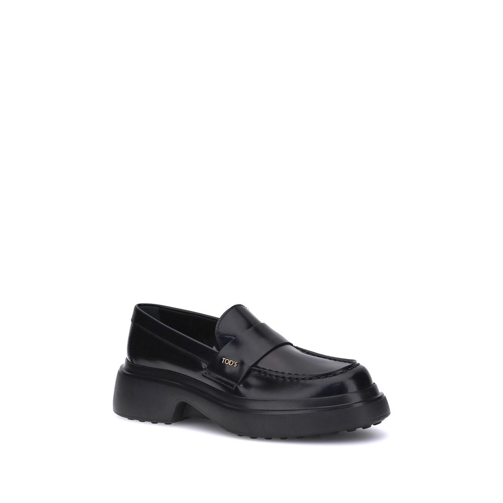 Tod's Black Rubber Platform Loafers with rubber sole and logo plaque, made in Italy, featuring calf leather upper.