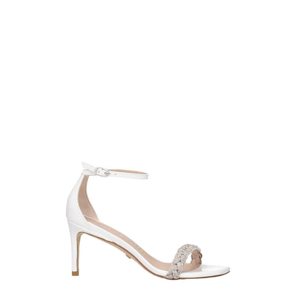 Stuart Weitzman White Leather Stiletto Heel Sandals with buckle closure and crystal embellishment.