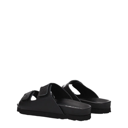 Palm Angels Black Leather Flat Sandals with strap closure and rubber sole, featuring front logo. Ideal for casual style.