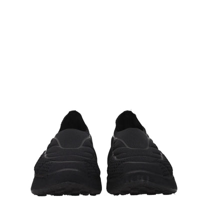 Givenchy Black Fabric Slip-On Loafers with side logo, round toe, and mid heels. MPN: BH0076H1C4001. Casual style with fabric sole.