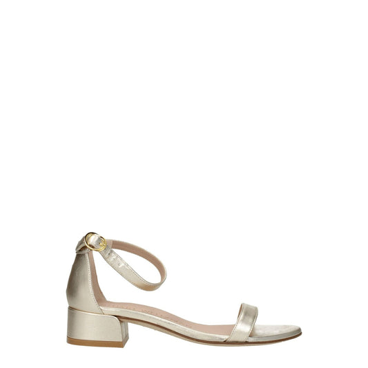 Stuart Weitzman Gold Leather Flat Sandals with buckle closure and mid heels, open toe style, made of metallic platinum leather.