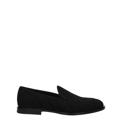Dolce & Gabbana Black Velvet Slip-On Loafers with round toe and leather sole, featuring a stylish design and logo embossing.