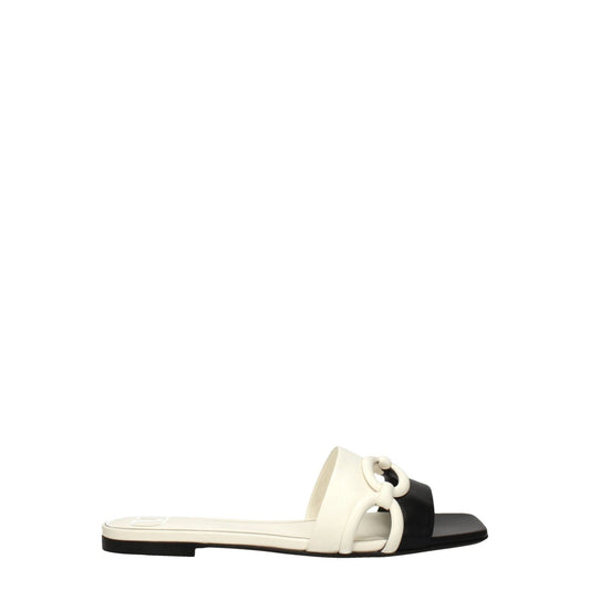 Valentino Garavani Black Leather Slippers, casual open-toe design with ivory accents and low flat heel, crafted in premium leather.