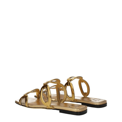 Valentino Garavani Gold Leather Slippers with open toe and low flat heel, made from gold leather with a casual style, designed by Valentino Garavani.