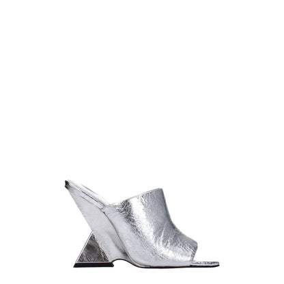 The Attico Gray Leather Platform Sandals with a high heel and open toe, featuring a vintage effect in silver leather, side view.