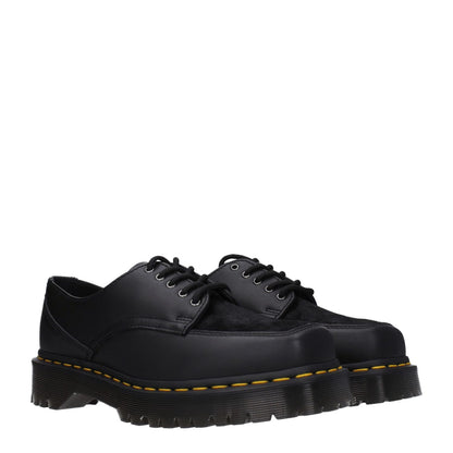 Dr. Martens Black Leather Oxfords And Derbies, casual lace-up shoes with rubber sole and mid heels, square toe, black leather upper.