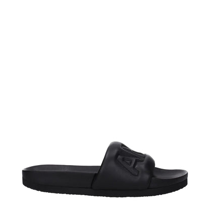 Ambush Black Leather Slippers with front logo, open toe, and rubber sole. Model BMIC001LEA0011000, street style.
