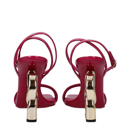 Dolce & Gabbana Pink Leather Stiletto Heel Sandals with gold accents and buckle closure, showcasing open toe and high heel design.