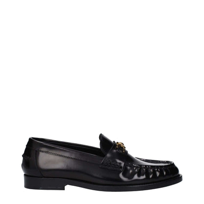 Versace Black Leather Slip-On Loafers with front detail and logo, round toe, low flat heel, casual leather sole.