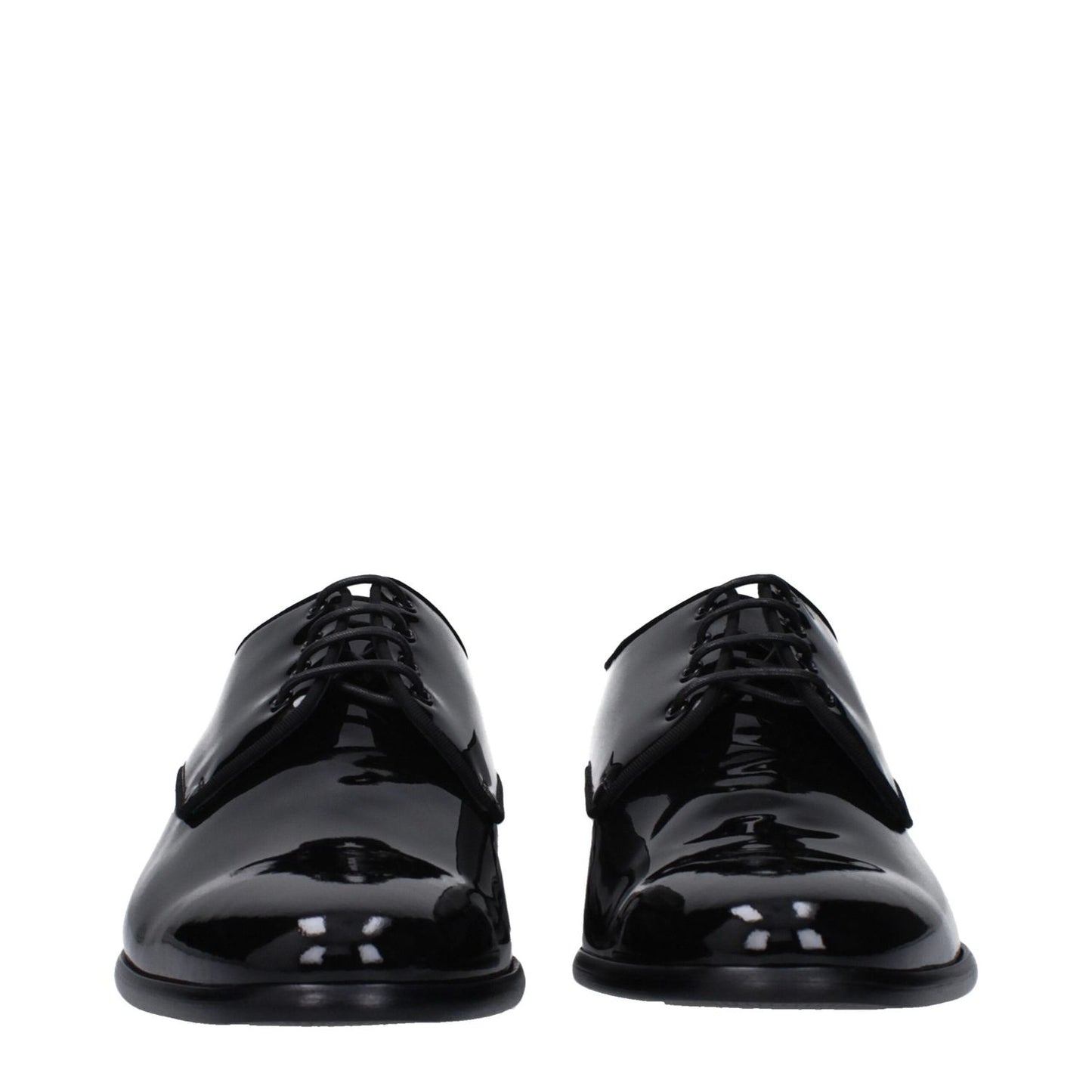 Dolce & Gabbana Black Leather Oxfords And Derbies with lace-up style and pointy toe, featuring a low flat heel and patent finish.