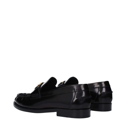 Versace Black Leather Slip-On Loafers with front detail and logo, featuring a round toe and low flat heel, perfect for casual style.