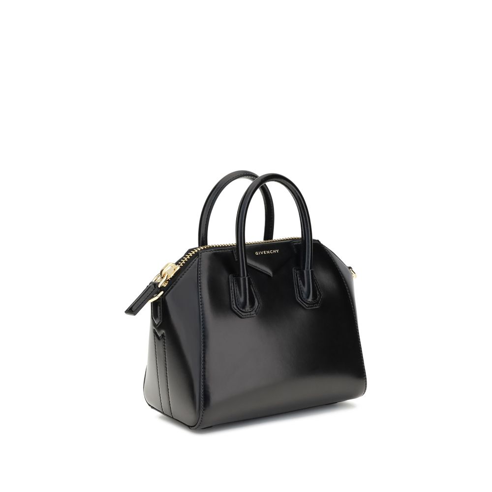 Givenchy Black Calf Leather Bos Taurus Handbag with glossy geometric design, top handles, and iconic monogram, AW25 collection.