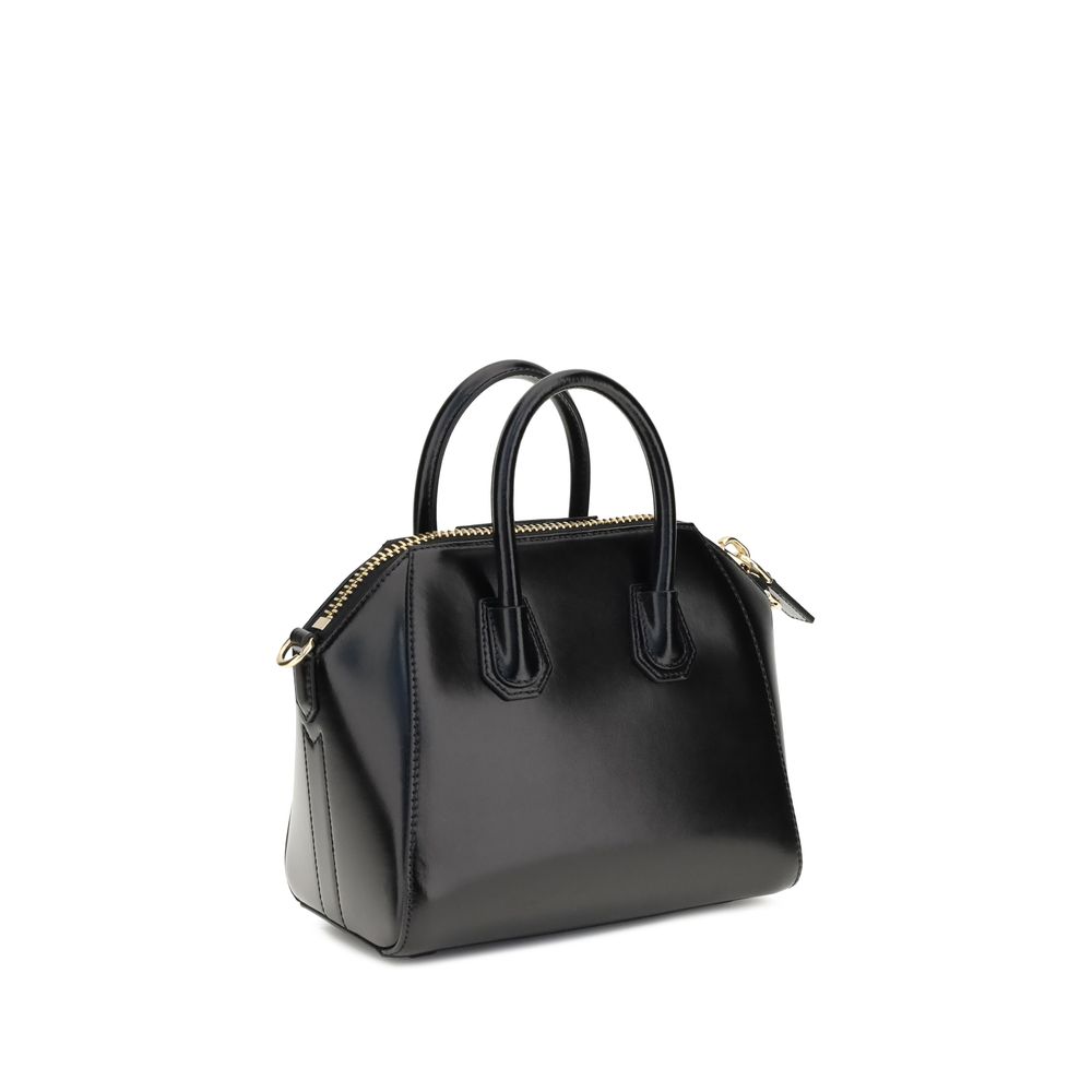 Givenchy Black Calf Leather Bos Taurus Handbag, glossy design with geometric pattern, zipper closure, and removable strap.