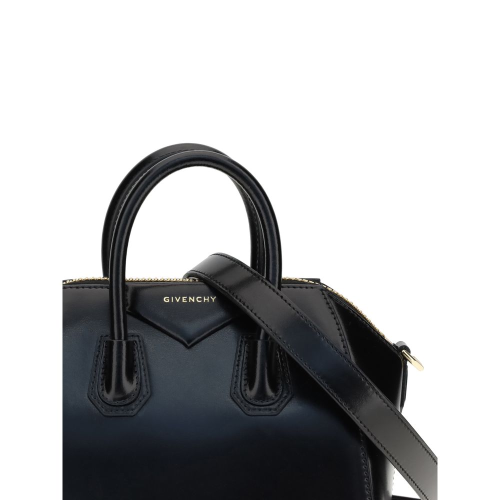 Alt Tag: Givenchy Black Calf Leather Bos Taurus Handbag with geometric design, two handles, adjustable strap, and brand monogram.