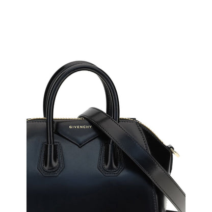 Alt Tag: Givenchy Black Calf Leather Bos Taurus Handbag with geometric design, two handles, adjustable strap, and brand monogram.