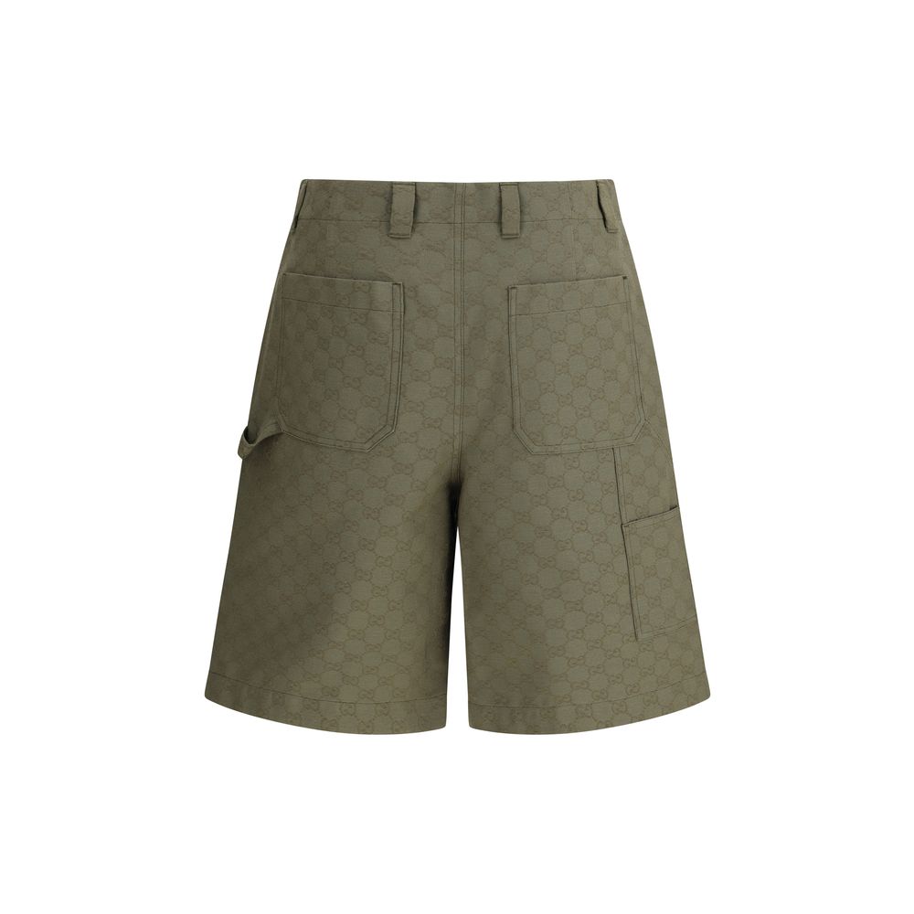 Gucci Green Cotton Bermuda Shorts with iconic GG pattern, featuring belt loops and front zipper, blend heritage and modernity. AW25.