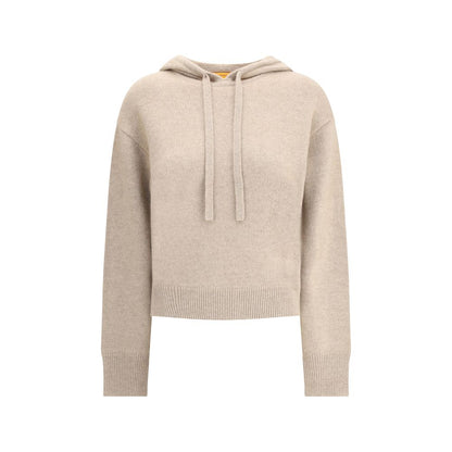 Guest in Residence Beige Cashmere Hoodie with adjustable drawstring hood and ribbed hem, offering a relaxed and sophisticated style.