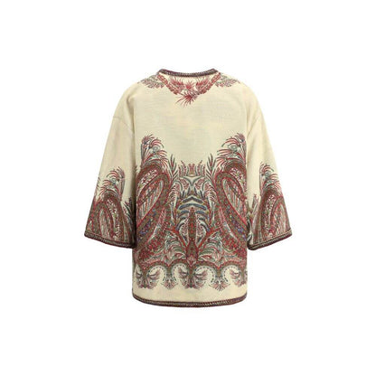 Back view of Etro Multicolor Polyester Cloacks featuring floral Paisley motif and kimono sleeves, showcasing boho-chic elegance.