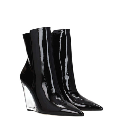 Stuart Weitzman Black Leather Ankle Boots with pointy toe and wedge heel, made of patent leather, featuring zip closure and punk rock style.
