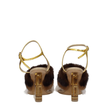 Fendi Brown Mink Strap-On Sandals with gold buckle and high heel, featuring vintage effect and open toe design, rear view.