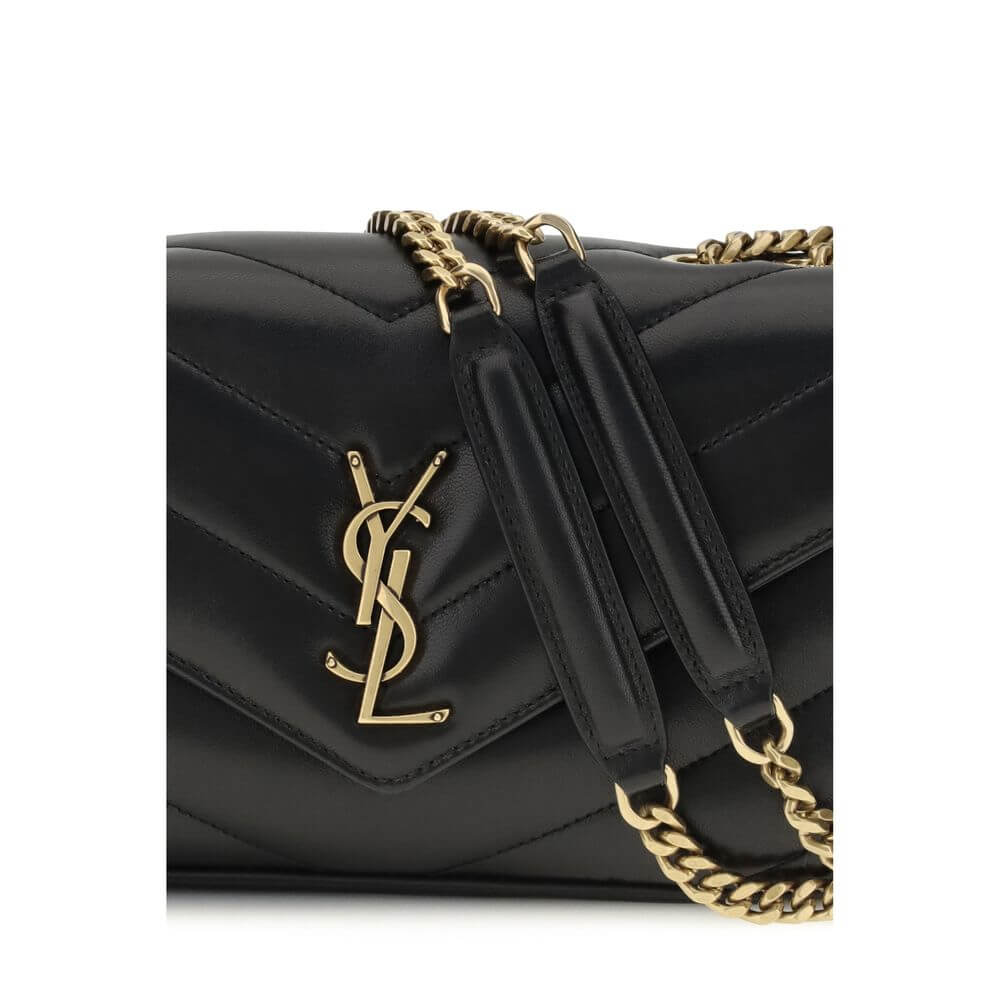 Close-up of Saint Laurent Black Lamb Ovis Aries Aries Shoulder Bag with quilted design and brass logo on magnetic flap.