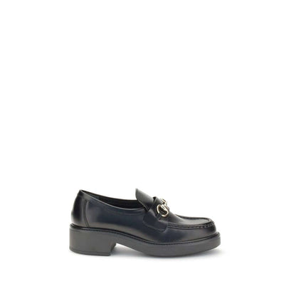 Gucci Black Calf Leather Bos Taurus Slip-On Loafers with iconic horsebit detail and block heel, perfect for formal or everyday wear.