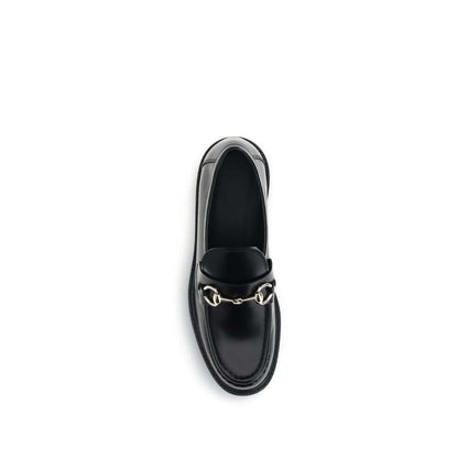 Gucci Black Calf Leather Bos Taurus Slip-On Loafers with horsebit detail, top view.