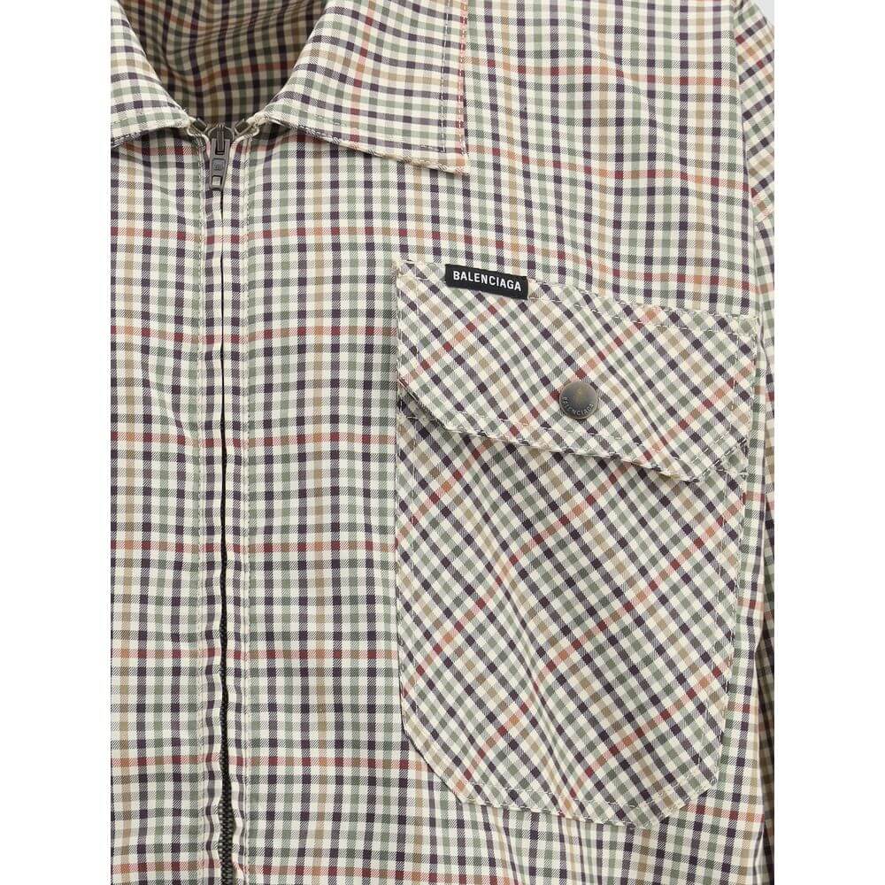 Balenciaga Multicolor Cotton Coat, checked flannel fabric, close-up of chest pocket with embroidered logo, AW25 collection.