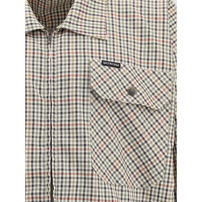 Balenciaga Multicolor Cotton Coat, checked flannel fabric, close-up of chest pocket with embroidered logo, AW25 collection.
