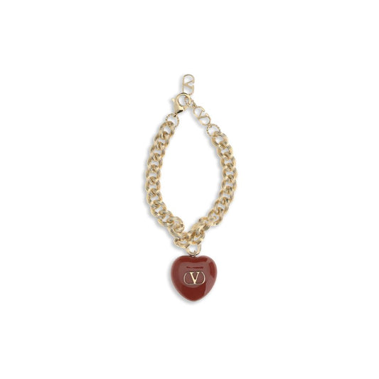 Valentino Garavani Gold Brass Bracelet with black heart charm and Signature VLogo, elegant chain jewelry accessory.