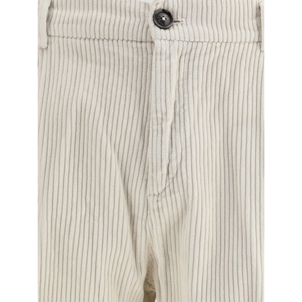 Close-up of Cruna White Cotton Casual Pants with zip-and-button closure and corduroy texture.