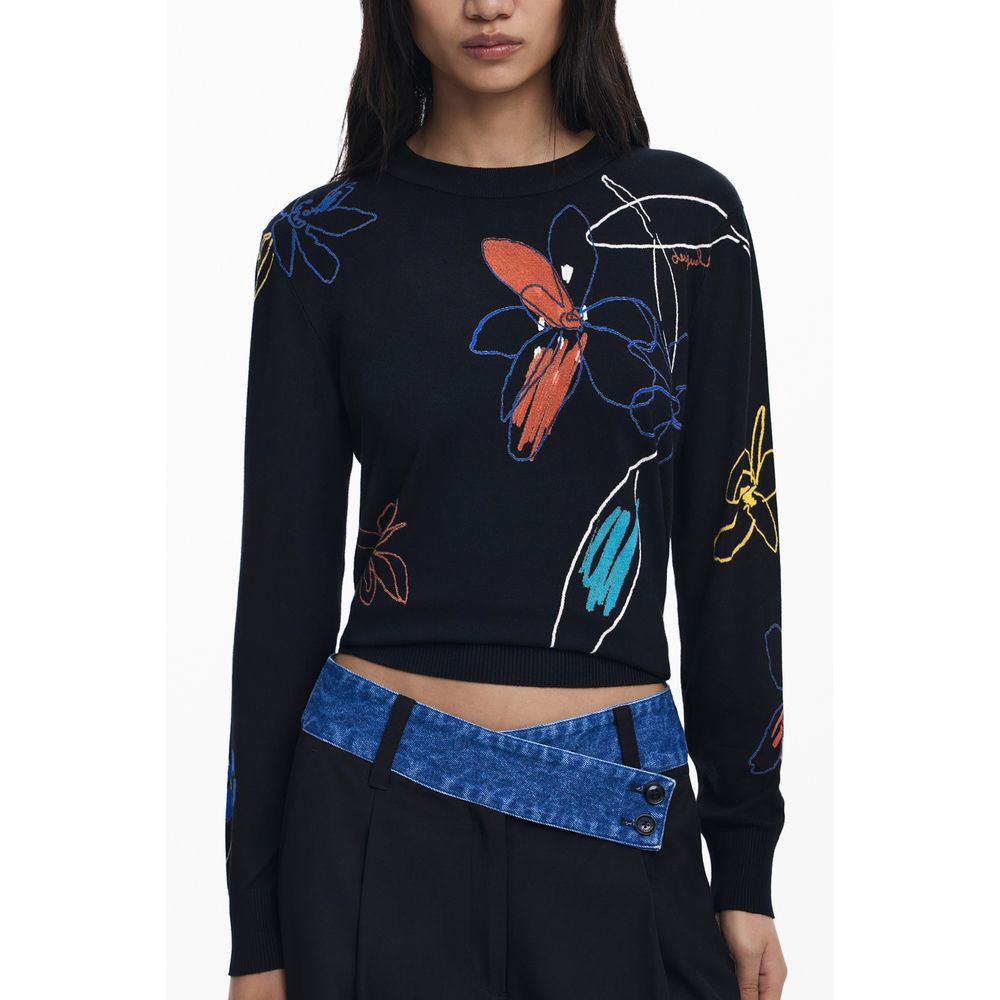 Woman wearing Desigual Black Viscose Women Sweater with floral pattern, long sleeves, crew neck.