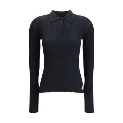 Dolce & Gabbana Black Cashmere Polo Shirt with ribbed design, classic collar, and three-button closure for elegant and versatile style.